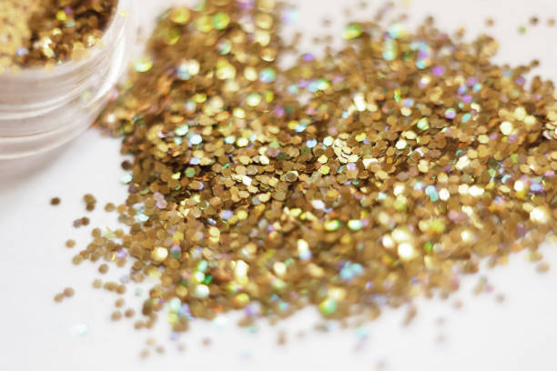 istock Gold sequins. placer gold glitter texture and background 666590082