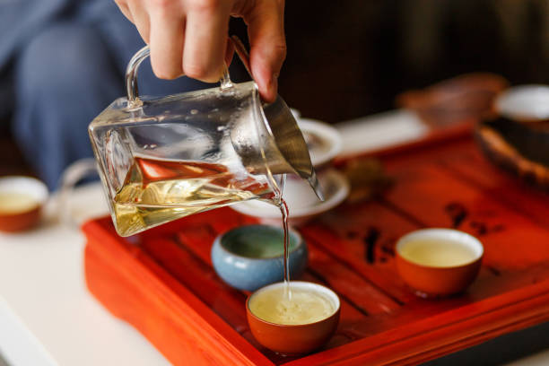 istock The tea ceremony. The hands of man pouring tea. 666597326