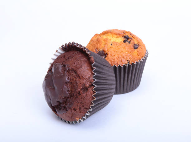 istock Fresh homemade muffins on white background. Top view. 666599574