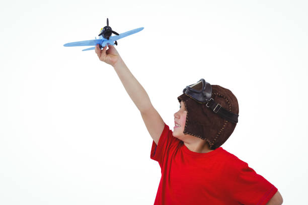 istock Boy playing with toy airplane 666600212
