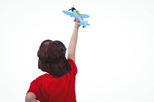 istock Boy playing with toy airplane 666600272