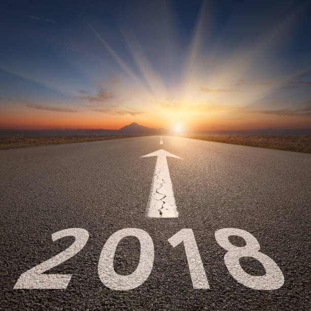 istock Driving on open road towards the 2018 at dawn 666603858