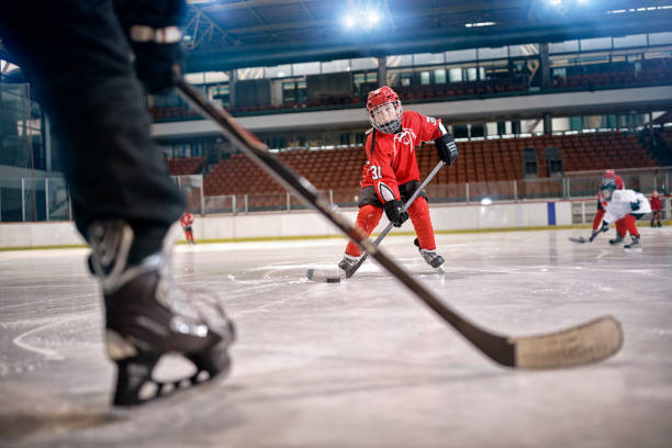 istock Hockey match at rink player in action 666607282