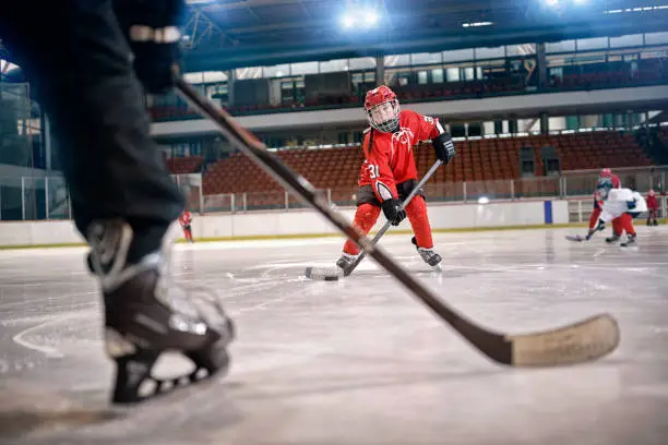 Photo of Hockey match at rink player in action