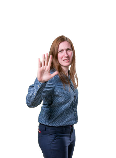 istock Young pretty girl making stop sign over white background 666608416