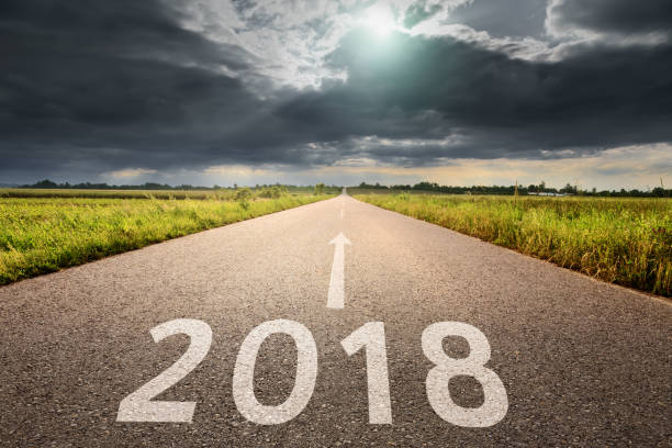 istock Empty road straight to upcoming and troublesome 2018 666608998
