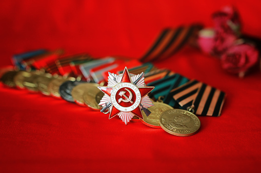 Awards of Merit in World War II by the Soviet Union on a vintage wooden background