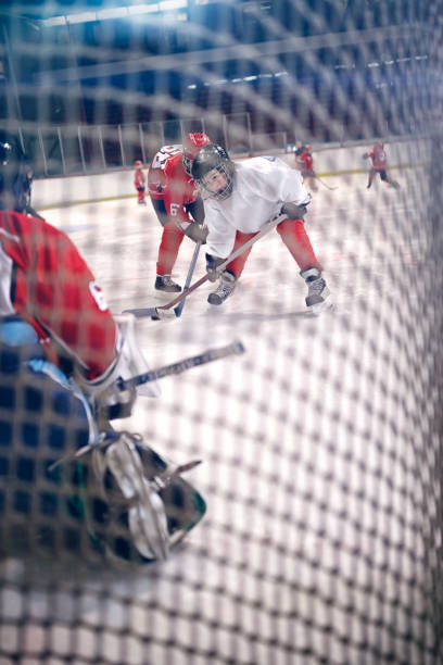 istock Hockey players shoots the puck and attacks 666614144