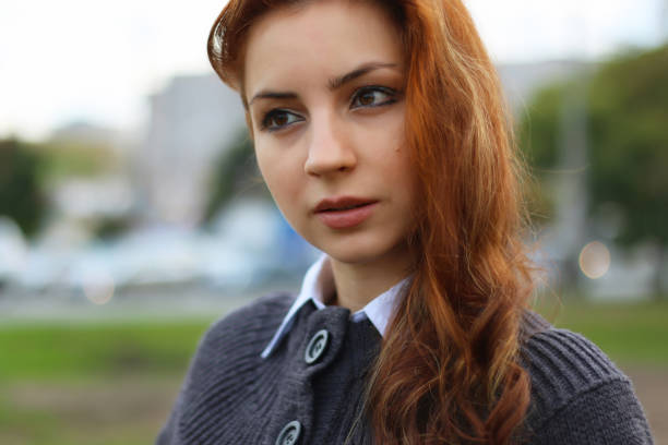 istock red-haired girl in autumn jacket 666617066