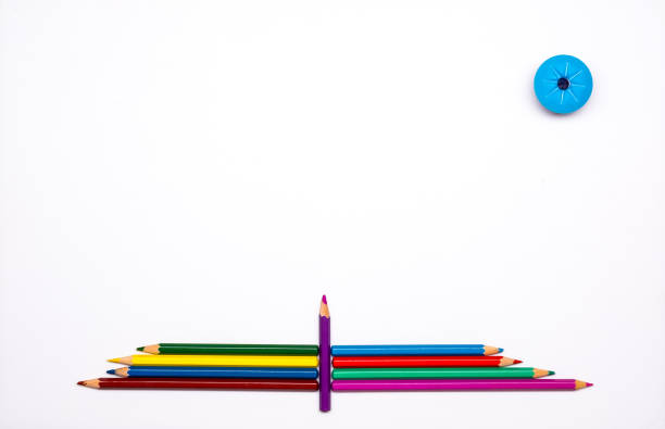 istock Colored Pencils And Sharpener On White Paper Background 666620488