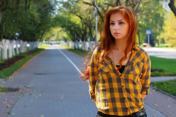 istock red-haired girl in a hat hipster 666621272