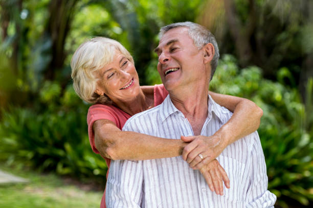 istock Senior couple embracing in yard 666621568