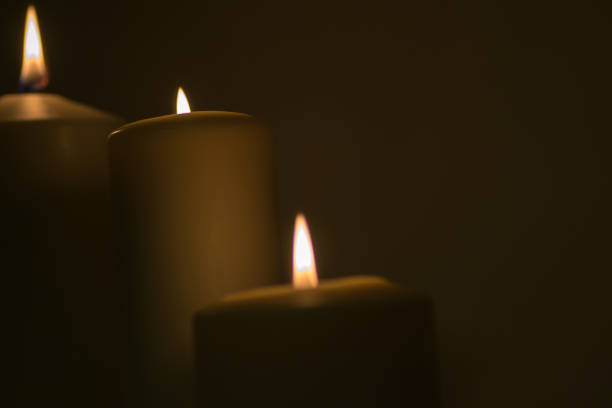 istock a candle is lit in the darkness 666621792