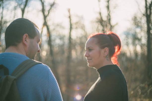 istock Beautiful young couple on a walk in autumn forest 666624552