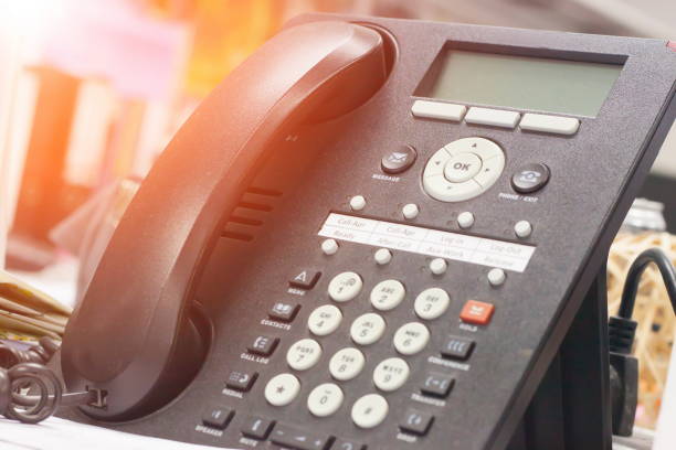 istock Telephone on desk in office with sunrise 666628070
