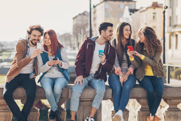 istock Group of cheerful friends talking and sharing 666631526