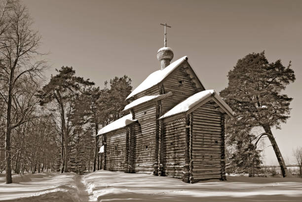 istock Rural wooden chapel winter landscape 666632282