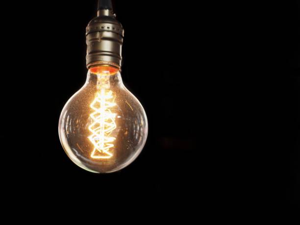 istock Close up of glowing light bulb 666634138