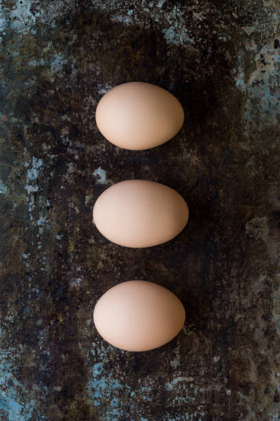 istock Three organic hen eggs, bio produce background 666634296