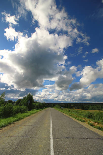 istock road in the field cloudy landscape 666634592