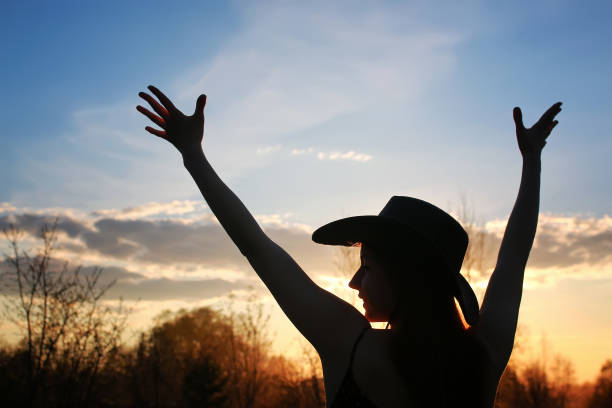 istock girl silhouette cowboy 666637812