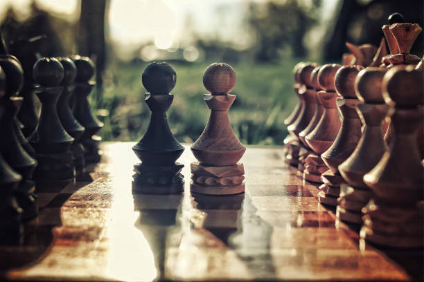 istock textured retro effect photo of chess on board concept 666638208