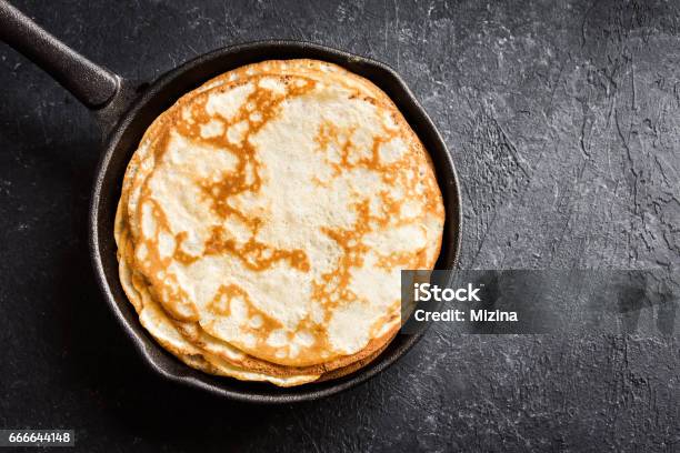Crepes In Cast Iron Pan Stock Photo - Download Image Now - Pancake, Cooking Pan, Butter