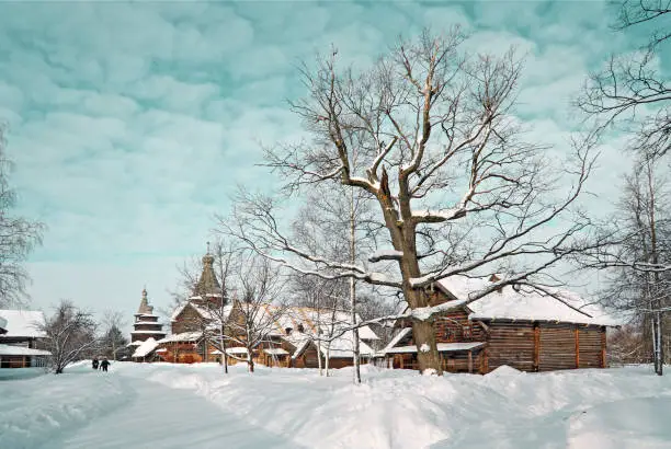 Snow-covered houses in winter wooden landscape vintage wooden buildings