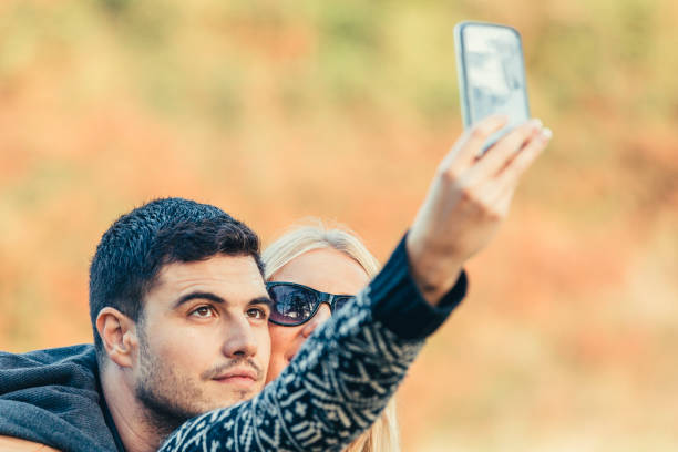 istock Young Couple Taking Selfie 666651778