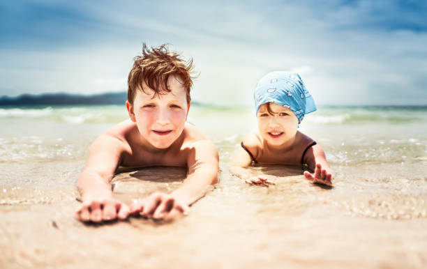 istock Cute boy relaxing in warm summer sea 666657356