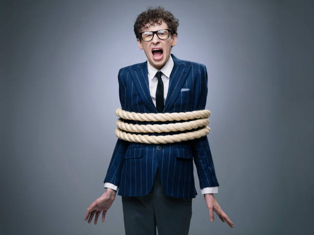 Business man tied up with rope