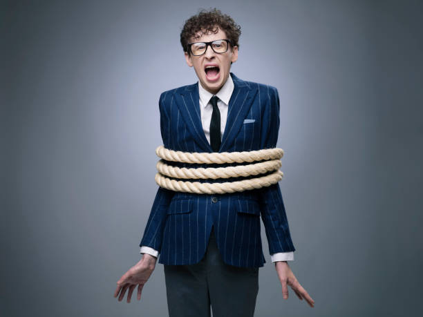 Business man tied up with rope Funny business man tied up with rope screaming for help tangled photos stock pictures, royalty-free photos & images