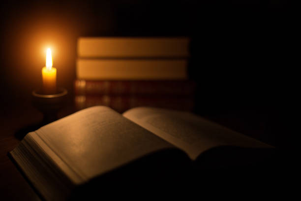 istock Concept of knowledge, vintage book candle 666675728