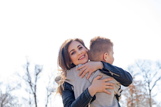 istock Happy little boy hugging his mother 666678538