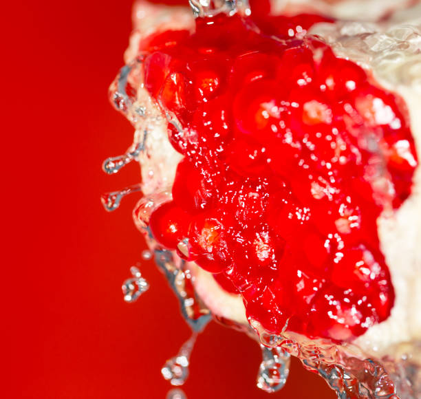 Ripe red pomegranate in water
