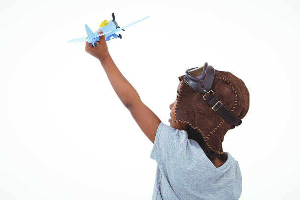 istock Standing girl playing with toy airplane 666692146