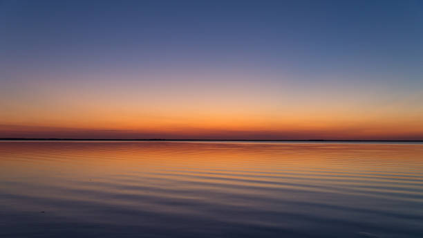 istock colored sky after sundown at the coast 666692174