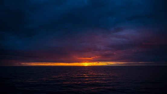 Setting Sun on the horizon at sea