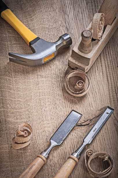 istock hammer planner chissels shavings on wood 666702220