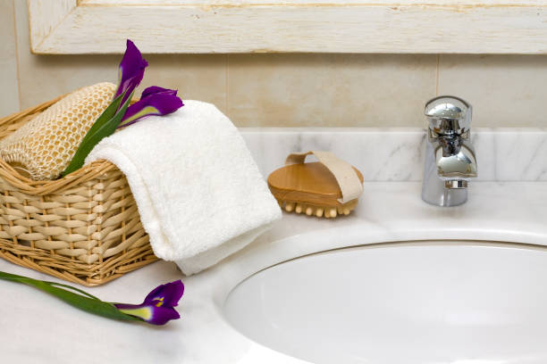 close up on old sink in bathroom with towel