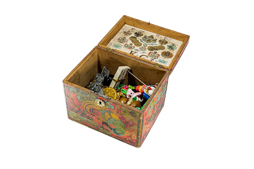 An antique casket produced in France in 1890 is filled with children's toys