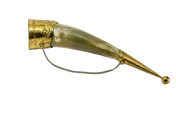 An ancient Georgian horn for wine on whitebackground