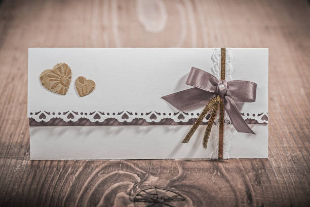 istock invitation card for wedding on wood board 666705912