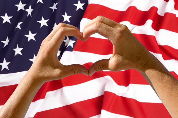 istock Hands heart symbol, USA flag 666708736