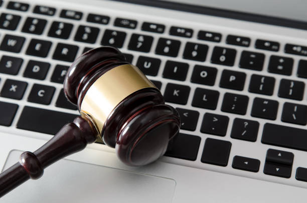 istock Wooden gavel on laptop keyboard 666709716