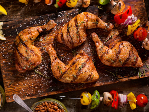 Grilled Chicken Legs With Vegetable Skewers Grilled Chicken Legs With Vegetable Skewers, Baked Beans and Coleslaw cooked stock pictures, royalty-free photos & images