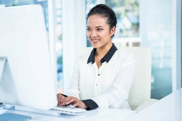 istock Smiling businesswoman typing on her computer 666713082