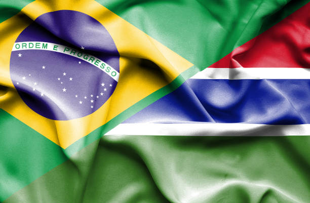 istock Waving flag of Gambia and Brazil 666713890