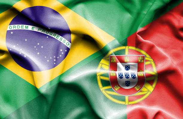 развевающийся флаг португалии и бразилии - brazil serbia stock illustrations