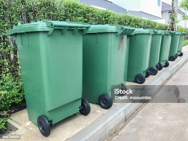 Row Of Green Plastic Bin Stock Photo - Download Image Now - Green Color, Environmental Conservation, Garbage Can